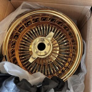 Luxor 14x7 gold center diamond cut wire wheel with Vogue tire