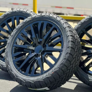 22 inch gloss black replica wheel with 285/45R22 all terrain tire mounted and balanced
